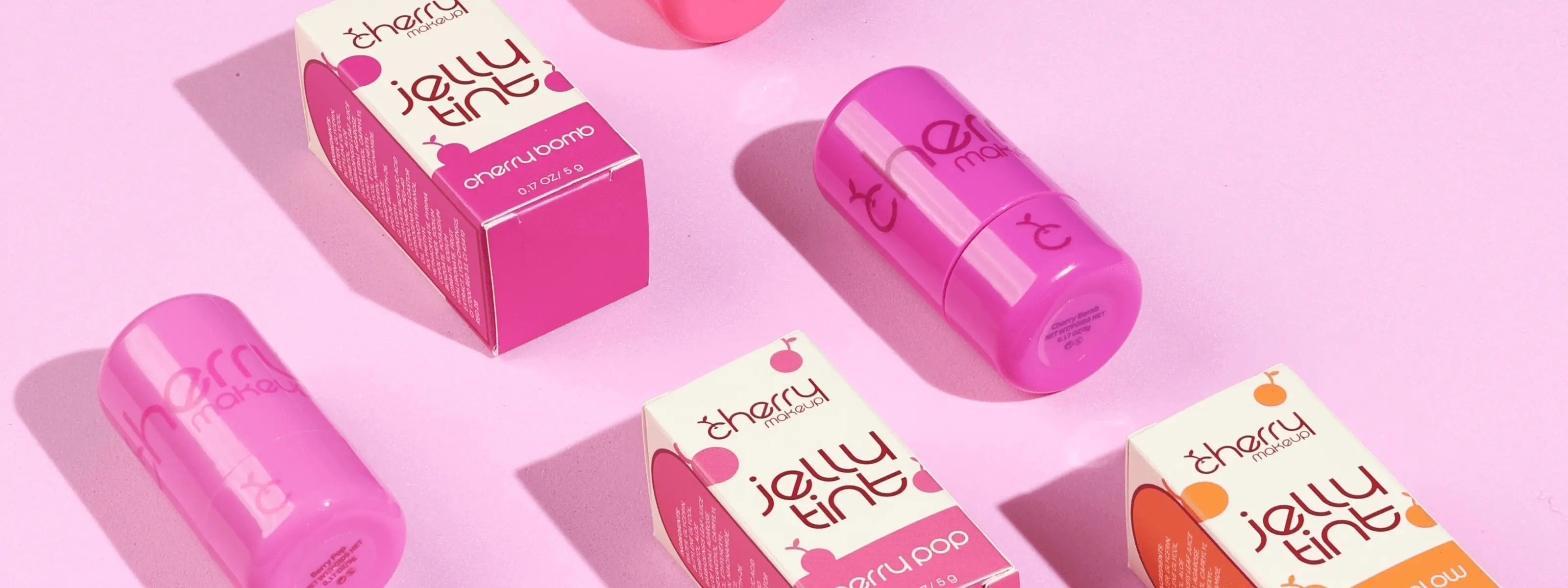 Cherry Makeup Jelly Tints collection on a pink background